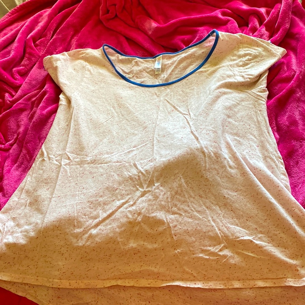 LulaRoe top cream color with red flecks and blue piping. Size XL.